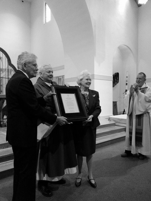 Rev. Richard Warner, CSC, Superior General, presents the Spirit of Holy Cross Award to Ed and Lea Zorn