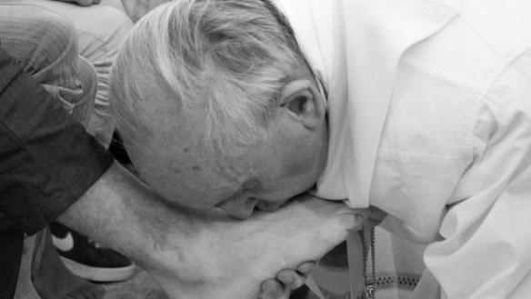 Pope Francis washing feet on Holy Thursday